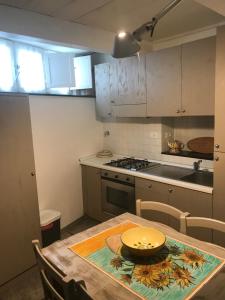 a kitchen with a wooden table with a bowl on it at Casa del Pescatore in Monterosso al Mare