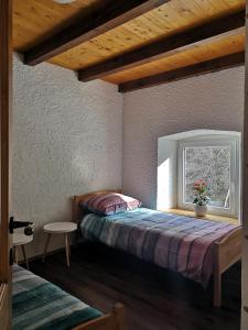 Uma cama ou camas num quarto em Apartma Humar