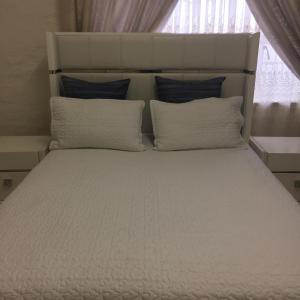 Katil atau katil-katil dalam bilik di Patzerella's Cozy Nest