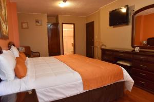 Postel nebo postele na pokoji v ubytování Hotel Makroz