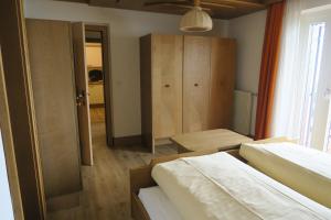 A bed or beds in a room at Residence Scheidnerhof