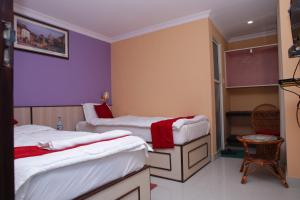 Postel nebo postele na pokoji v ubytování Hotel Tranquil