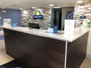 a reception desk in a dental office with a counter top at Days Inn by Wyndham King-Winston Salem Area in King