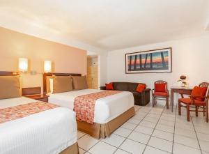 Postel nebo postele na pokoji v ubytování Hotel Veracruz Centro Histórico