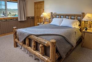 Ένα ή περισσότερα κρεβάτια σε δωμάτιο στο Stanley High Country Inn