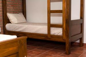 Una cama o camas en una habitación de Cabañas La Luisa