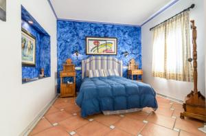Postel nebo postele na pokoji v ubytování Habitaciones en Casa Céntrica con piscina