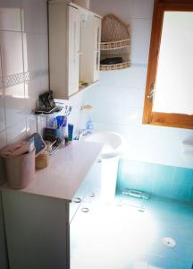 a bathroom with a sink and a counter top at Il rifugio di Elena in Maiori