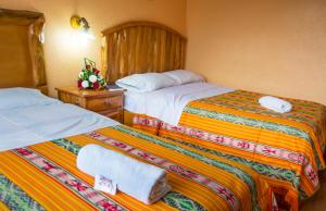 Postel nebo postele na pokoji v ubytování Hotel Santafe Inn
