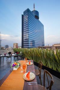 a table on the roof of a building at Isaaya Hotel Boutique by WTC in Mexico City