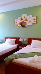 מיטה או מיטות בחדר ב-Tabii hotel