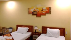 Letto o letti in una camera di Tabii hotel