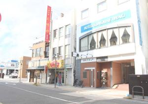 a building on the side of a city street at Hotel Sunshine Iwaki in Iwaki