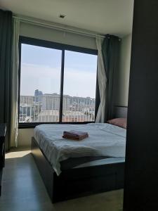 Postel nebo postele na pokoji v ubytování 芭提雅THE BASE海景度假酒店（可以安排接机服务和一切旅游安排）