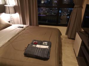 Postel nebo postele na pokoji v ubytování 芭提雅THE BASE海景度假酒店（可以安排接机服务和一切旅游安排）