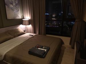 Postel nebo postele na pokoji v ubytování 芭提雅THE BASE海景度假酒店（可以安排接机服务和一切旅游安排）