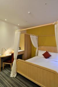 Postel nebo postele na pokoji v ubytování In Young Hotel