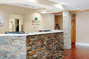 a lobby of a hospital with a brick wall at Quality Inn & Suites in Robbinsville