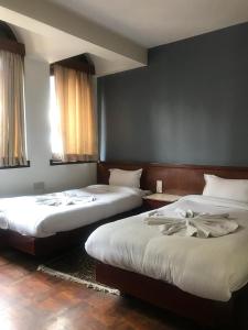 Un pat sau paturi într-o cameră la Hotel Earth House