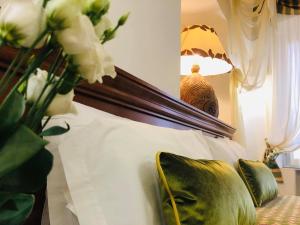 Postel nebo postele na pokoji v ubytování Hotel Astigiana & Appartamenti