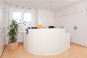 an office with a large white reception desk at Hotel Everest in Barcelona