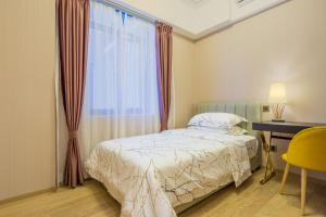 Ένα ή περισσότερα κρεβάτια σε δωμάτιο στο Mai Ha Dun Lang De International Apartment