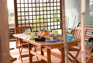 a wooden table with food on it in a room at La Terrazza in Empoli