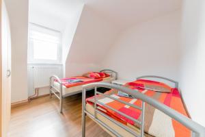 a bedroom with two bunk beds and a window at Private House in Hannover