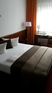 Voodi või voodid majutusasutuse Hotel "Am Fischhof" toas
