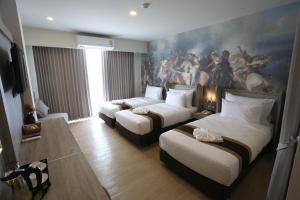 Postel nebo postele na pokoji v ubytování Bright Hotel