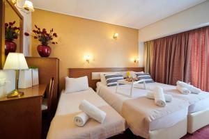 Ένα ή περισσότερα κρεβάτια σε δωμάτιο στο Crystal City Hotel +30 φωτογραφίες