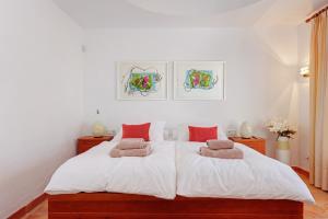 Un pat sau paturi într-o cameră la Buccara Villa Levante
