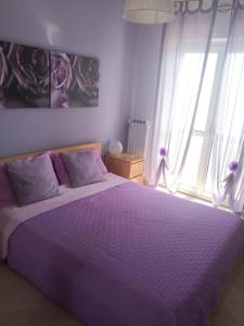 Postel nebo postele na pokoji v ubytování B&B LA BAIA Sea Rooms