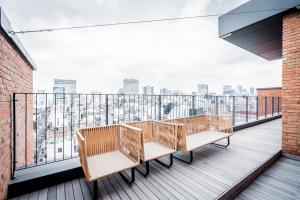 a balcony with benches overlooking a city skyline at Patio 7 in Seoul