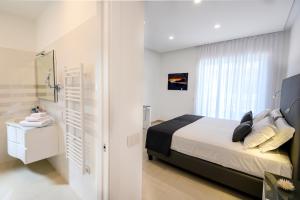 מיטה או מיטות בחדר ב-Angiolina Suite