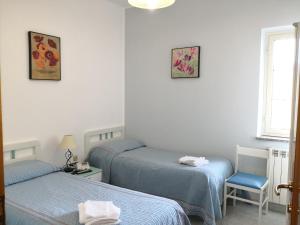 Postel nebo postele na pokoji v ubytování Palia's Hotel