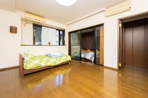 Un pat sau paturi într-o cameră la 平楽園弐番館２階