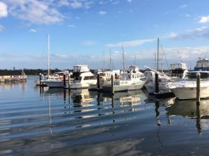 a group of boats docked in the water at Lakes Entrance Views in Lakes Entrance