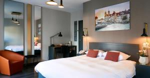 מיטה או מיטות בחדר ב-Atlas Hotel Brussels