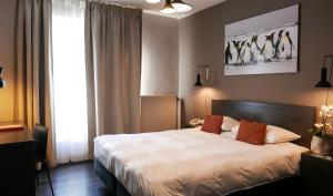 Postel nebo postele na pokoji v ubytování Atlas Hotel Brussels