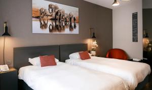 Postel nebo postele na pokoji v ubytování Atlas Hotel Brussels