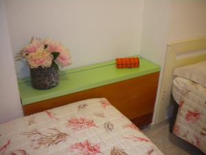 A bed or beds in a room at Villa Nespole e Vermentino