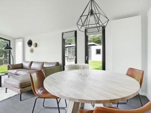 a dining room with a table and chairs at Chalet in Zell am See near Ski Slope in Markelo