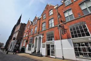 a group of brick buildings on a city street at Modern One Bed Apartment, by Kipz City Centre Chester - Amazing Location & Quiet! in Chester