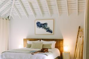 A bed or beds in a room at Elysian Luxury Eco Island Retreat
