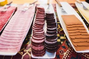 a table with three plates of cookies on it at Gjestehuset 102 in Longyearbyen