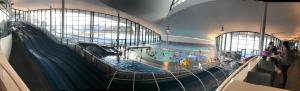 a large indoor swimming pool in a building at Chalet A03 in Courchevel