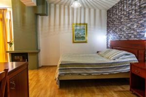 Ένα ή περισσότερα κρεβάτια σε δωμάτιο στο Το Χάνι του Κοκκίνη, Πήλιο