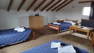 Postel nebo postele na pokoji v ubytování Tondoris Apartments