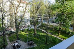 a view of a park with benches and trees at Puzzle Apartment in Dedinje